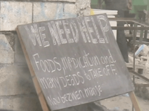 "We Need Help" sign - Haiti Earthquake